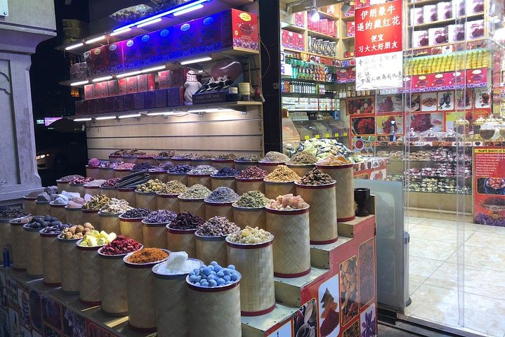 Experience the colorful array of spices and scents at Dubai's Spice Souk where every stall invites you to explore unique flavors and rich culinary traditions.